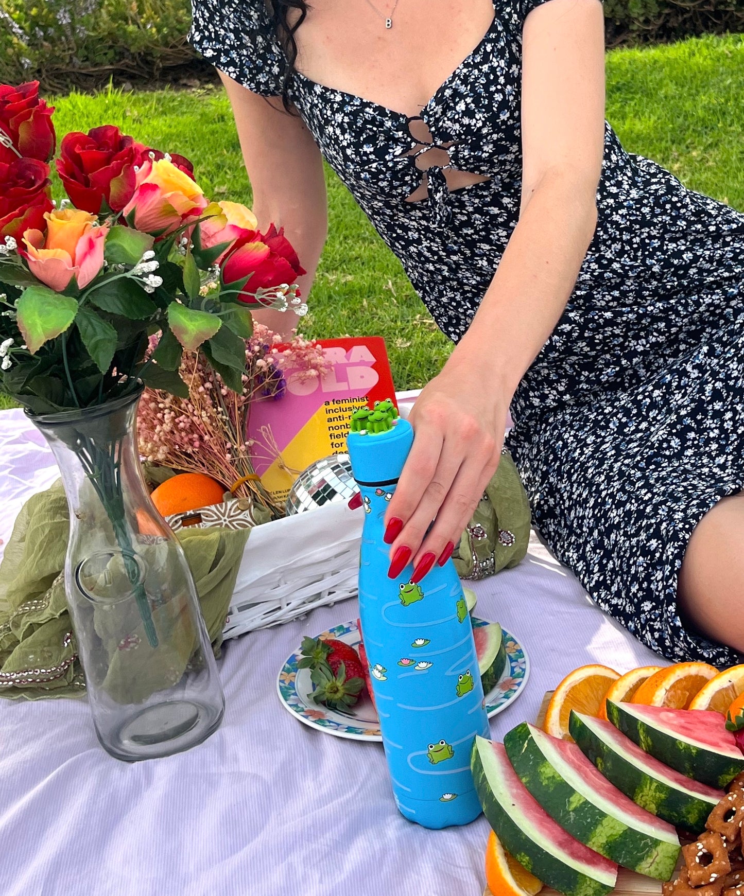 girl holding lily pad bottle